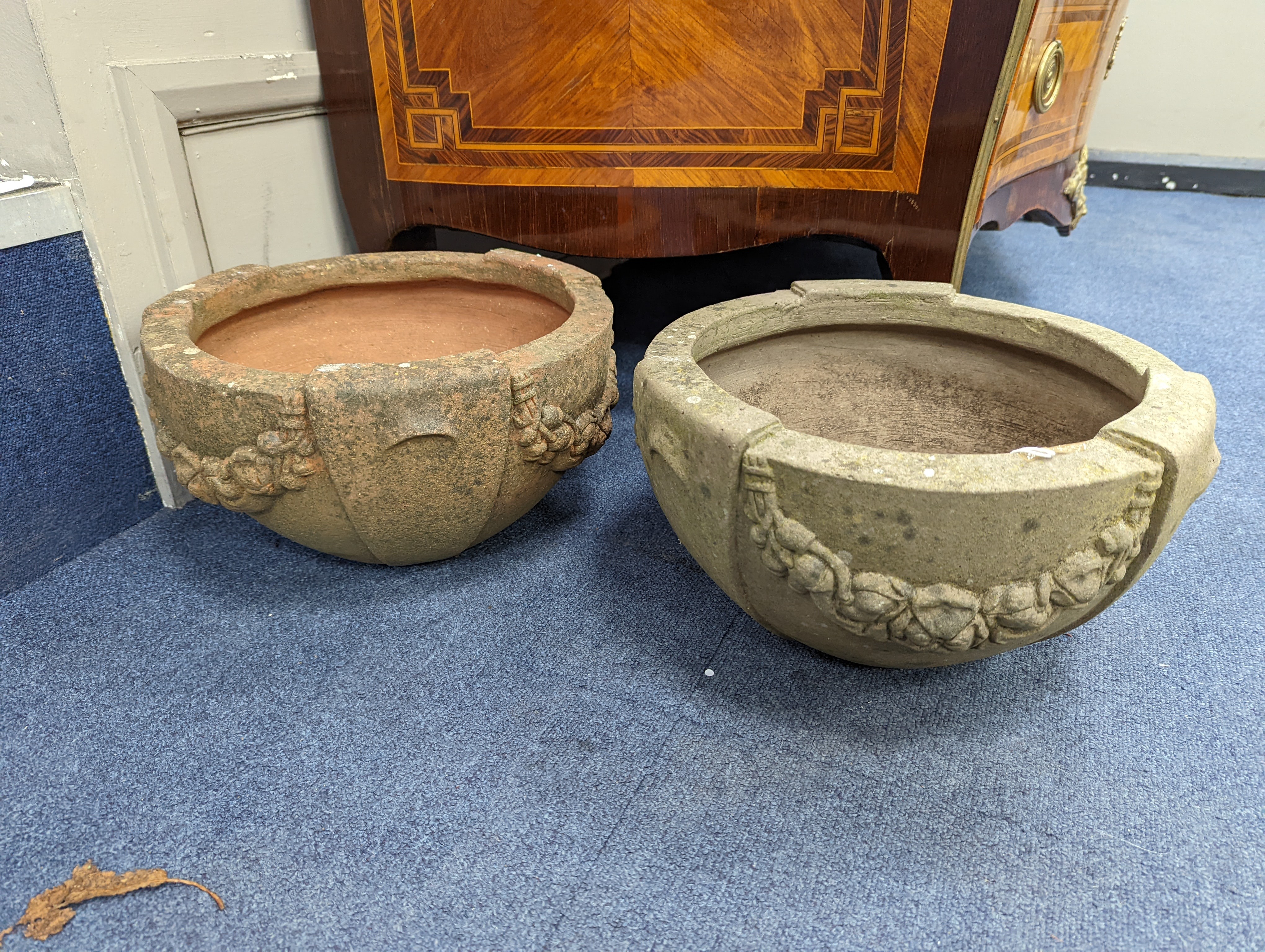 A pair of Compton terracotta poppy pattern planters, diameter 34cm, height 19cm